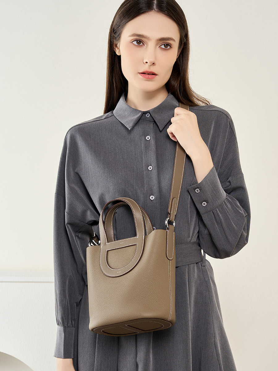 Full-Grain Leather Bucket Bag  Minimalist Cutout Tote with Modern Patchwork Design