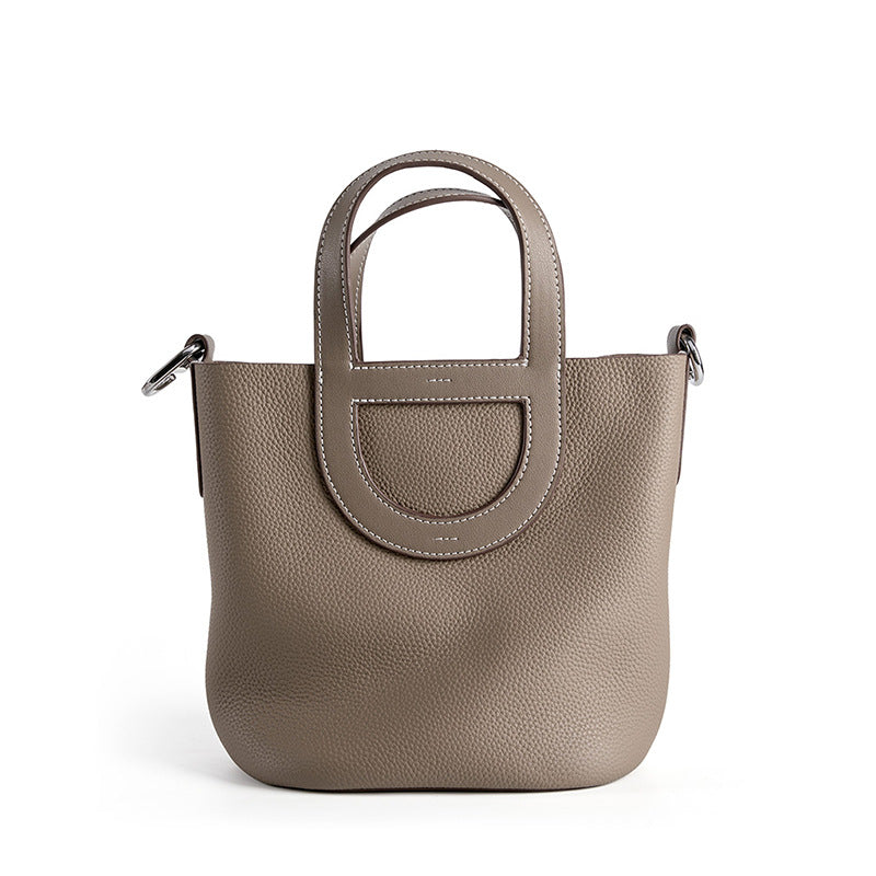 Full-Grain Leather Bucket Bag  Minimalist Cutout Tote with Modern Patchwork Design